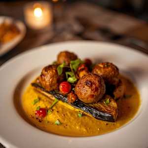 Grilled lamb kofta, aubergine begendi, Aleppo butter & spring onion
